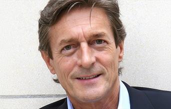 Man looking at the camera in a suit