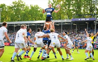 a man being lifted up in rugby