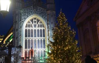 Bath Abbey with Christmas tree, illuminated at night