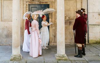 A group of people wearing Regency costume