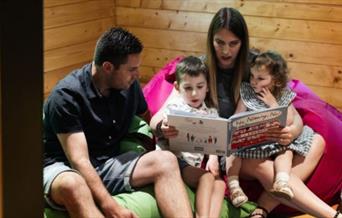parents reading to their children