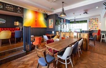 Tables and chairs inside The Cork