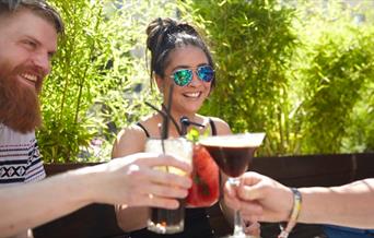 People clinking drinks
