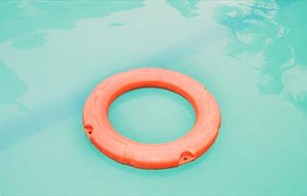 Orange rubber ring in pool