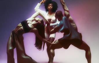 Three dancers forming a triangle shape