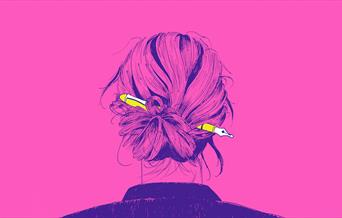 Looking at the back of a woman's hair pinned up with a fountain pen