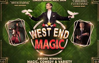 A magician holding two white doves