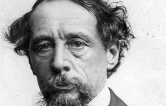 A photograph of Charles Dickens.