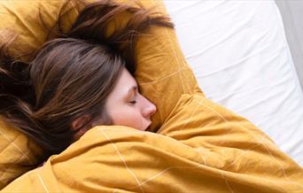 Woman sleeping in bed