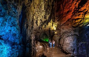 Family in illuminated Wookey Hole Caves - Caves near Bristol and Bath