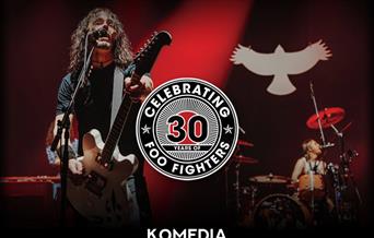 Promotional poster for a UK Foo Fighters concert at Komedia Bath on Friday 9 May 2025. The poster features a guitarist singing into a microphone with