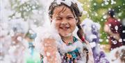 A girl in a foam party