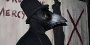 person in plague mask