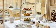 An afternoon tea at the Pump Room Restaurant, featuring scones, cakes, and sandwiches