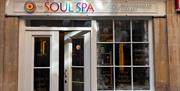 Entrance to The Soul Spa with a rainbow-coloured sign above the front door.