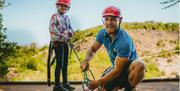 Child and instructor about to abseil at Mendip Basecamp