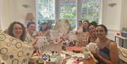 Group creating tea towels