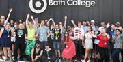 Bath College Students below sign