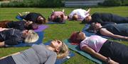 Women doing yoga stretches