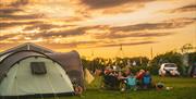 Family gathering around at Mendip Basecamp
