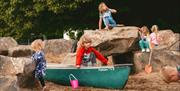 Family enjoying sand area at Mendip Basecamp
