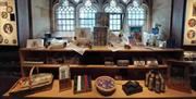 Bookmarks, mugs, and photographs and artwork of Bath Abbey