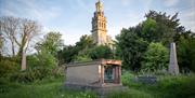 Beckford's Tower & Museum with the grave of William Beckford in the foreground