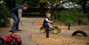 Bowood House and Gardens - Child and parent playing on the mini race track