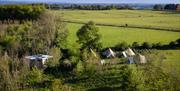 An aerial view of a group of tents in a field