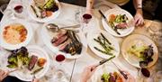 A table laden with food at the Emberwood brasserie in central Bath