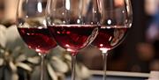 Three glasses of red wine