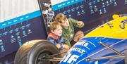 Childen with Formula 1 car at Haynes Motor Museum