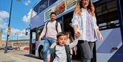 Family leaving bus