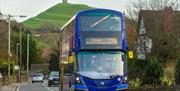 A blue and beige coloured 376 bus from First Bus travelling through Glastonbury, Somerset.
