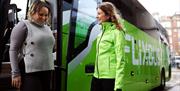 Passenger and driver interacting outside of the coach