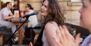 Singer performing outside Green Park Brasserie