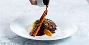 Gravy being poured over food