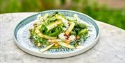 One of the plates on an outdoor table at Iford Manor Kitchen.