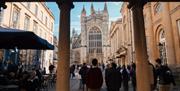 Photo of Bath Abbey from arches near the Roman Baths