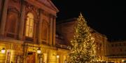 Bath Christmas Market with a large Christmas Tree in the square outside the Pump Rooms
