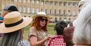 Tour guide discussing the Royal Crescent with their tour group