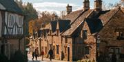 People walking in a village in the Cotswolds