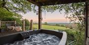 View of the fields from the hot tub on the porch of the treehouse