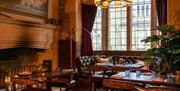 The George Inn historic dining room with fireplace and large window