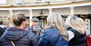 Tour guide informing the members of the tour.