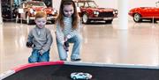 Children playing with remote control cars at Haynes Motor Museum