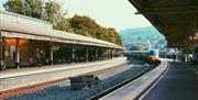 A train pulling into Bath Spa train station.