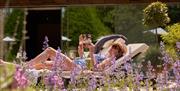 A woman lounging in the Spa at Lucknam Park in Thickwood, near Bath