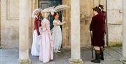 A group of people wearing Regency costume