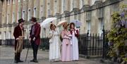 A group of people wearing Regency costume in Bath